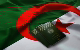 algerian passports on top of an algerian fla algerian passports on top of an algerian fla