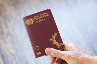 Hand Holding Portuguese Passport Hand Holding Portuguese Passport
